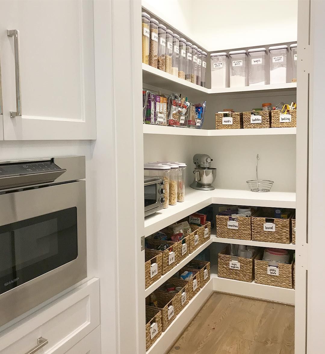 Pantry with labeled baskets and jars